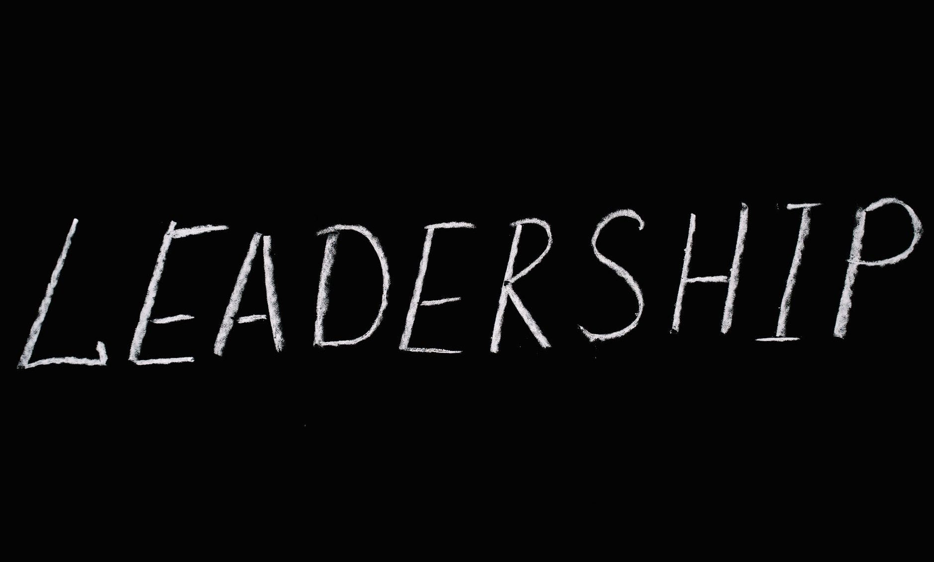 leadership lettering text on black background